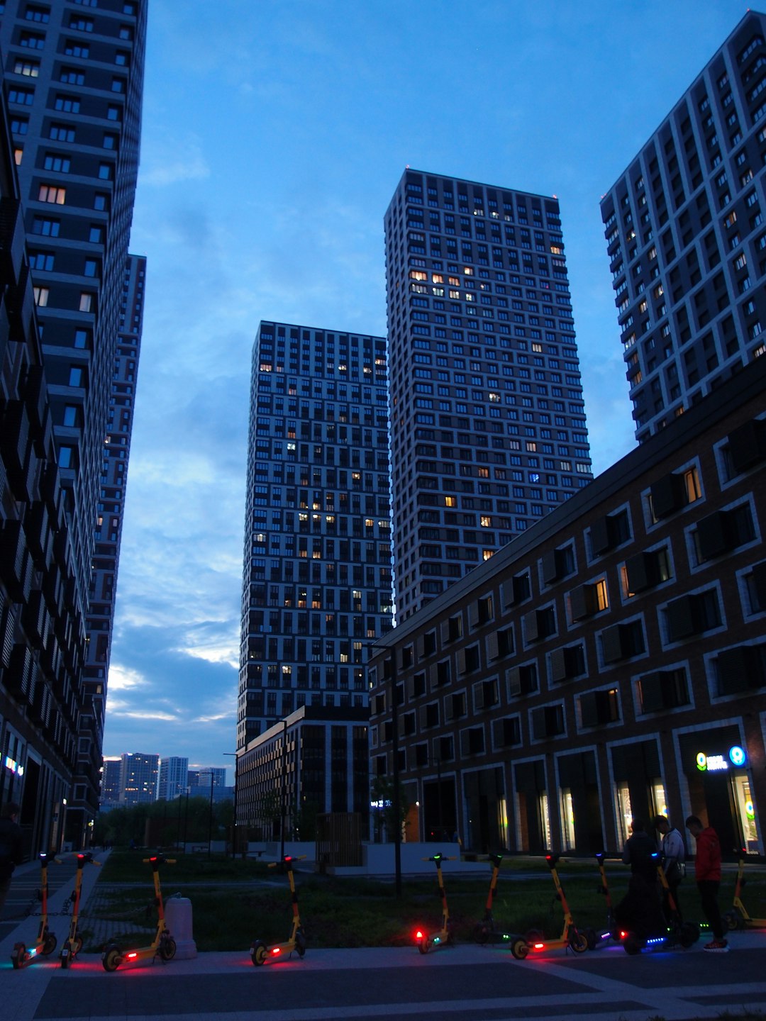a-couple-of-tall-buildings-sitting-next-to-each-other-i1fhqrirybk